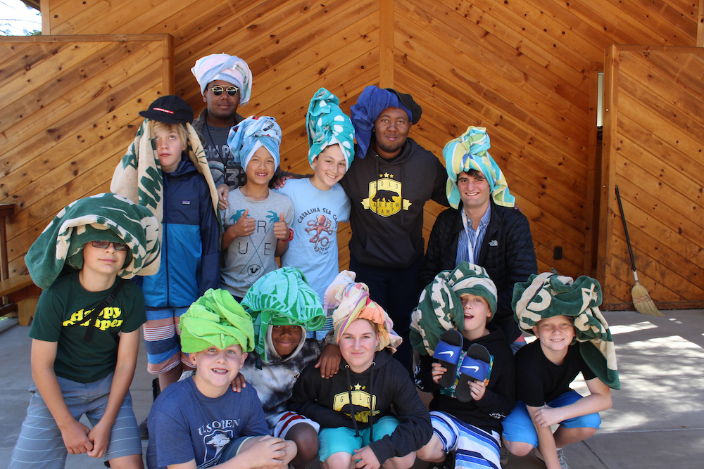 A group of boys pose with their counselors at Gold Arrow Camp in California