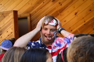 Simba, a camp counselor, dances with a crowd at a summer camp in California, Gold Arrow Camp